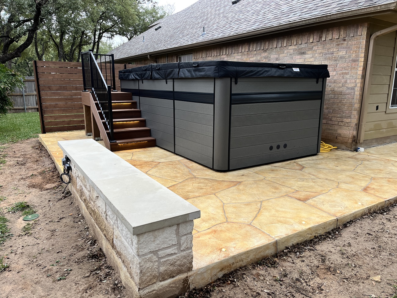 hardscape with hot tub
