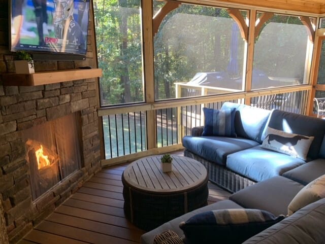 A living room with a fireplace and a couch