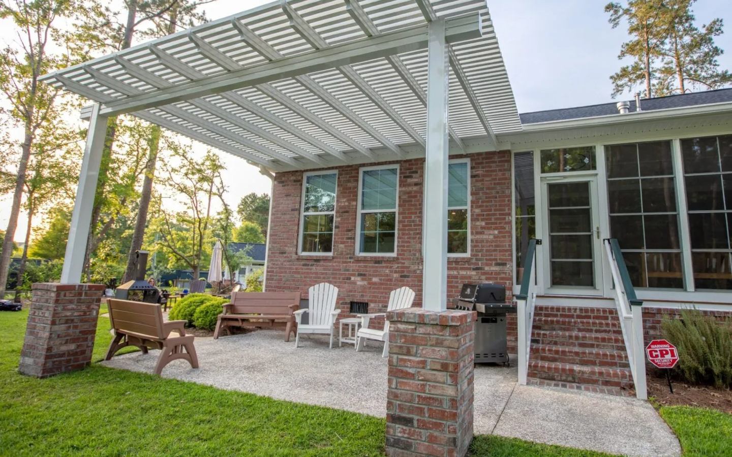 A house with a covered patio
Description automatically generated