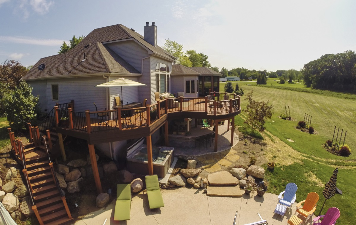 wooden deck wrapping around house