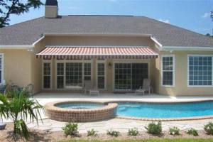 patio with awning and pool 