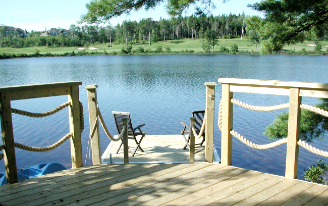 https://www.archadeck.com/images/blog/pressure-treated-deck-dock-boat-halifax-golf-course-railing-water-nautical-2.jpg