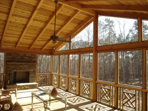 screened porch with fans and fireplace