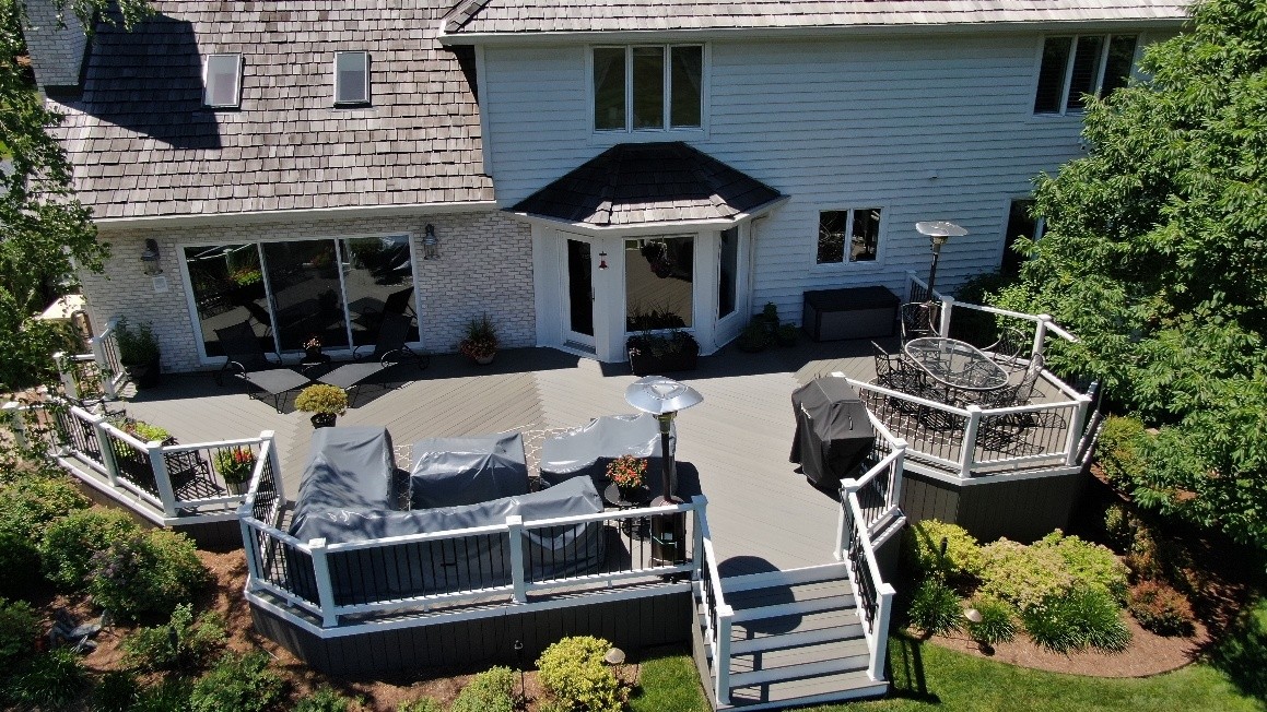 Custom TimberTech deck that spans across the entire back of a Long Grove home..
