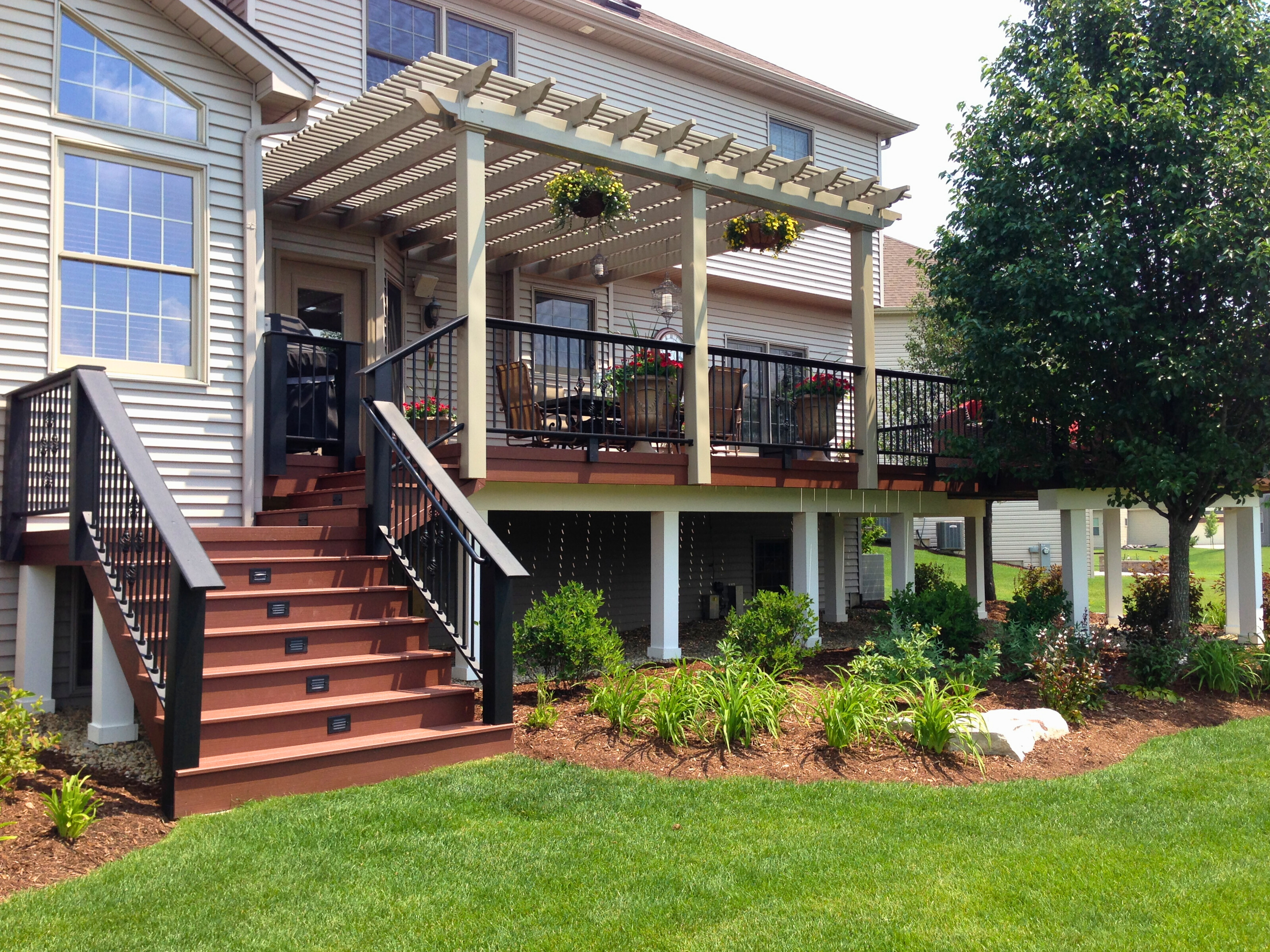Second-story Composite deck with aluminum rails and gorgeous white pergola in Arlington heights, IL.