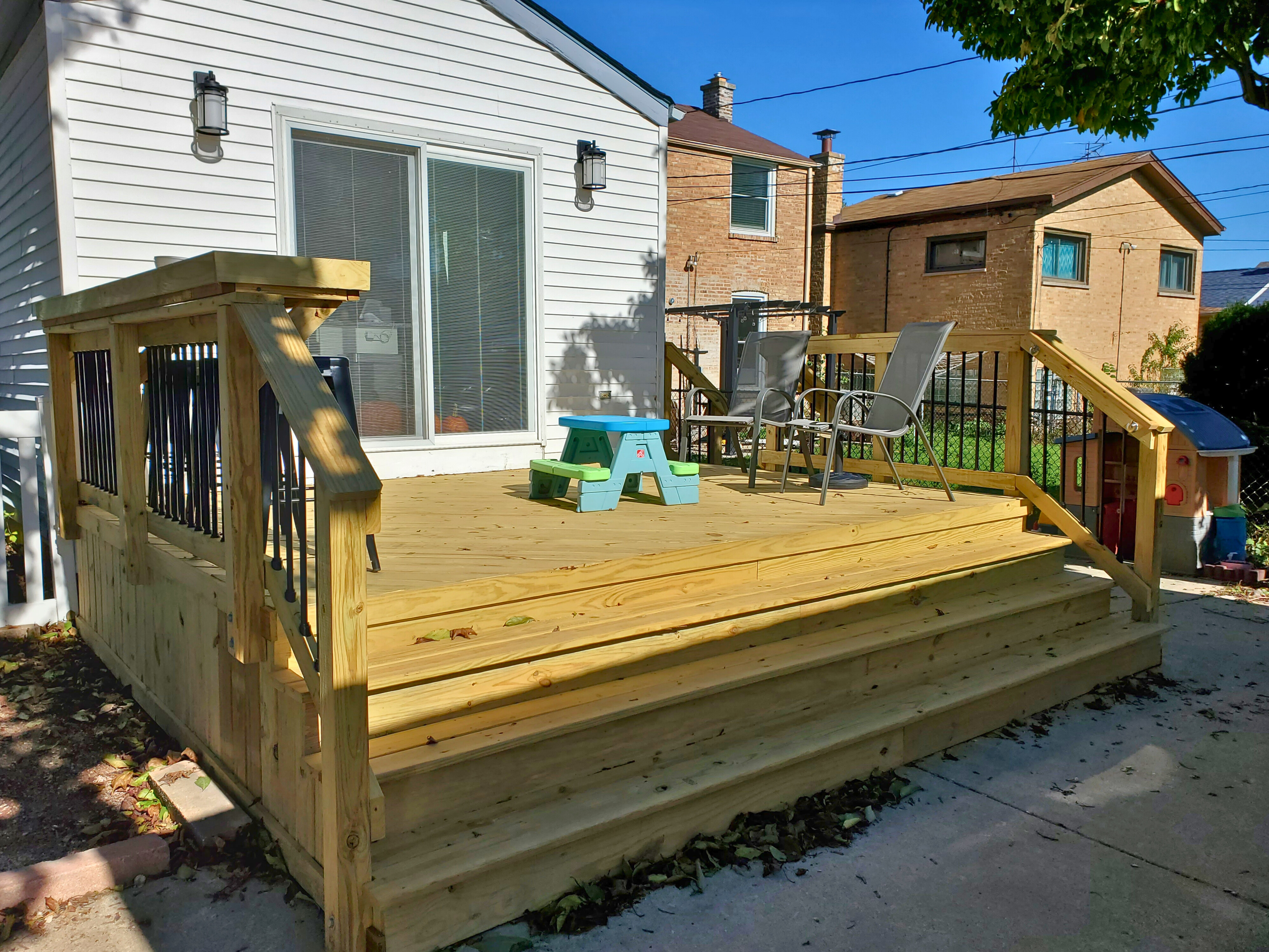 Wood deck with wide staircase in Evanston, IL