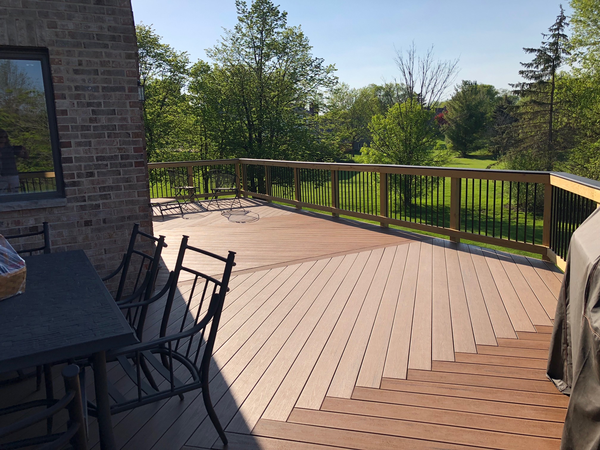 Gorgeous expansive brown composite deck in Deer Park, IL by Archadeck of Chicagoland.