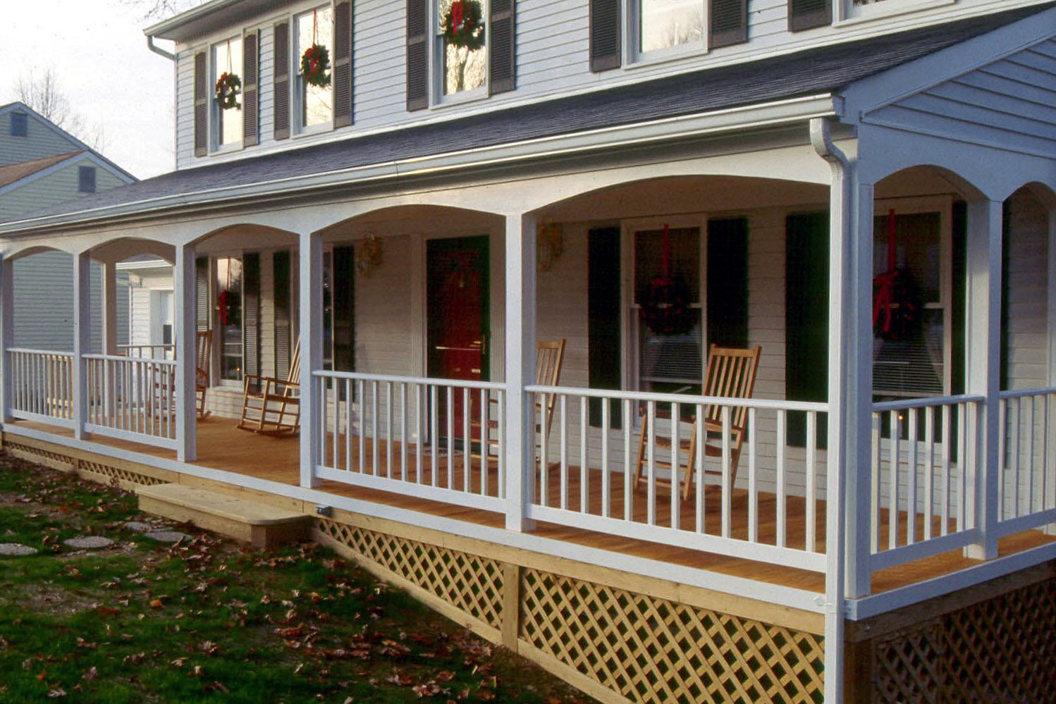 Charming front porch spanning the entire width of a Naperville home designed and built by Archadeck of Chicagoland-Napervile.