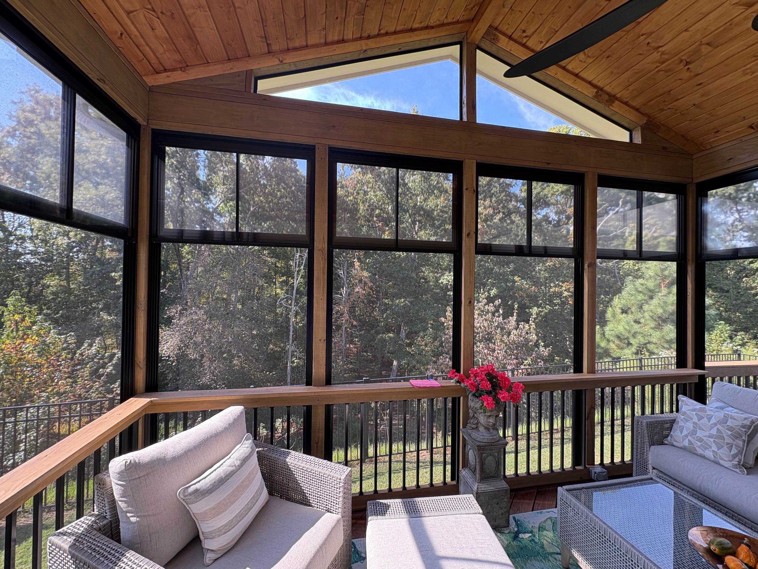 Eze-Breeze porch overlooking greenery and trees in Lake Wylie, SC.