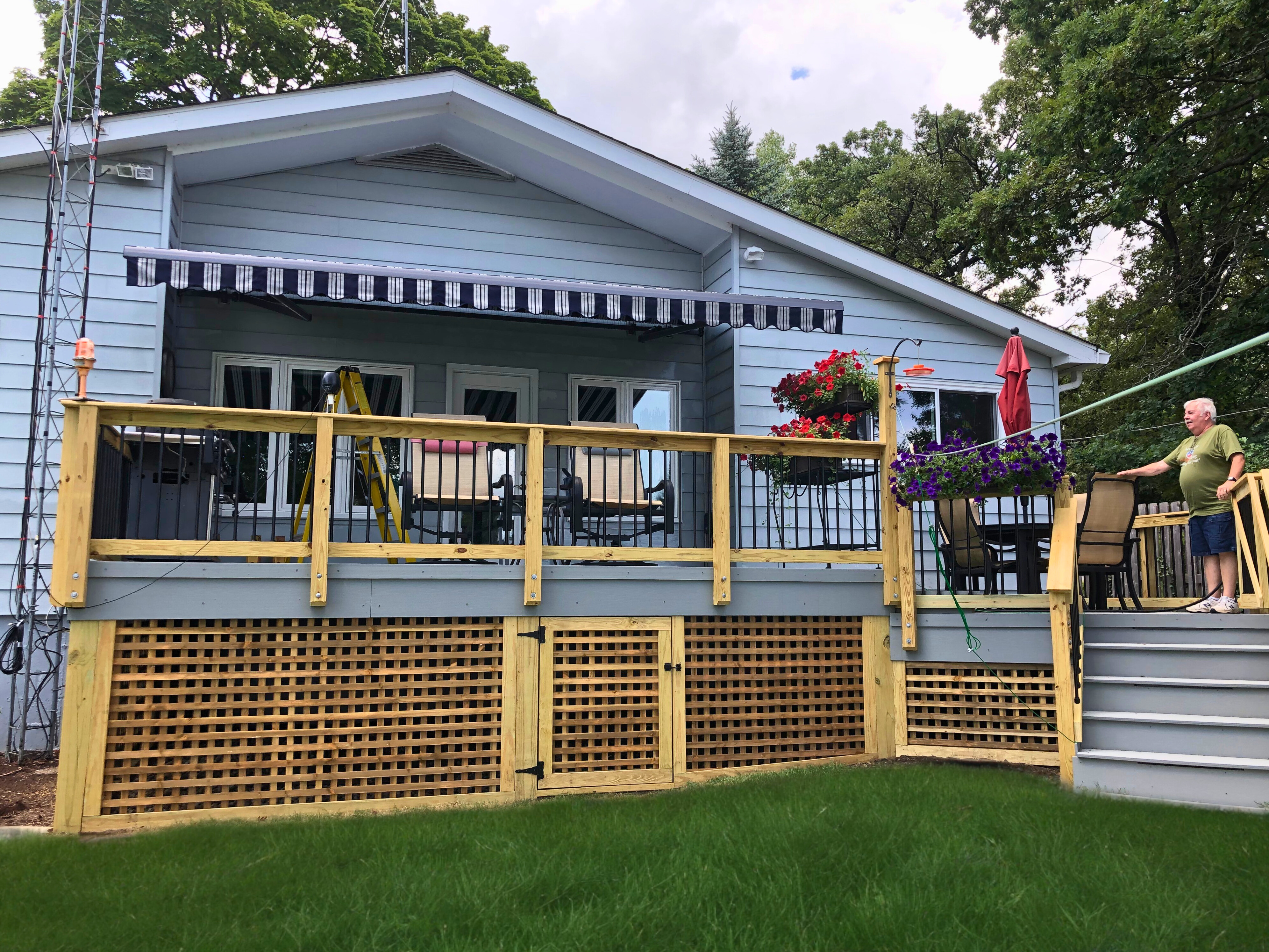 Custom wood deck with lattice skirting and grey trim in Lake Zurich, IL.