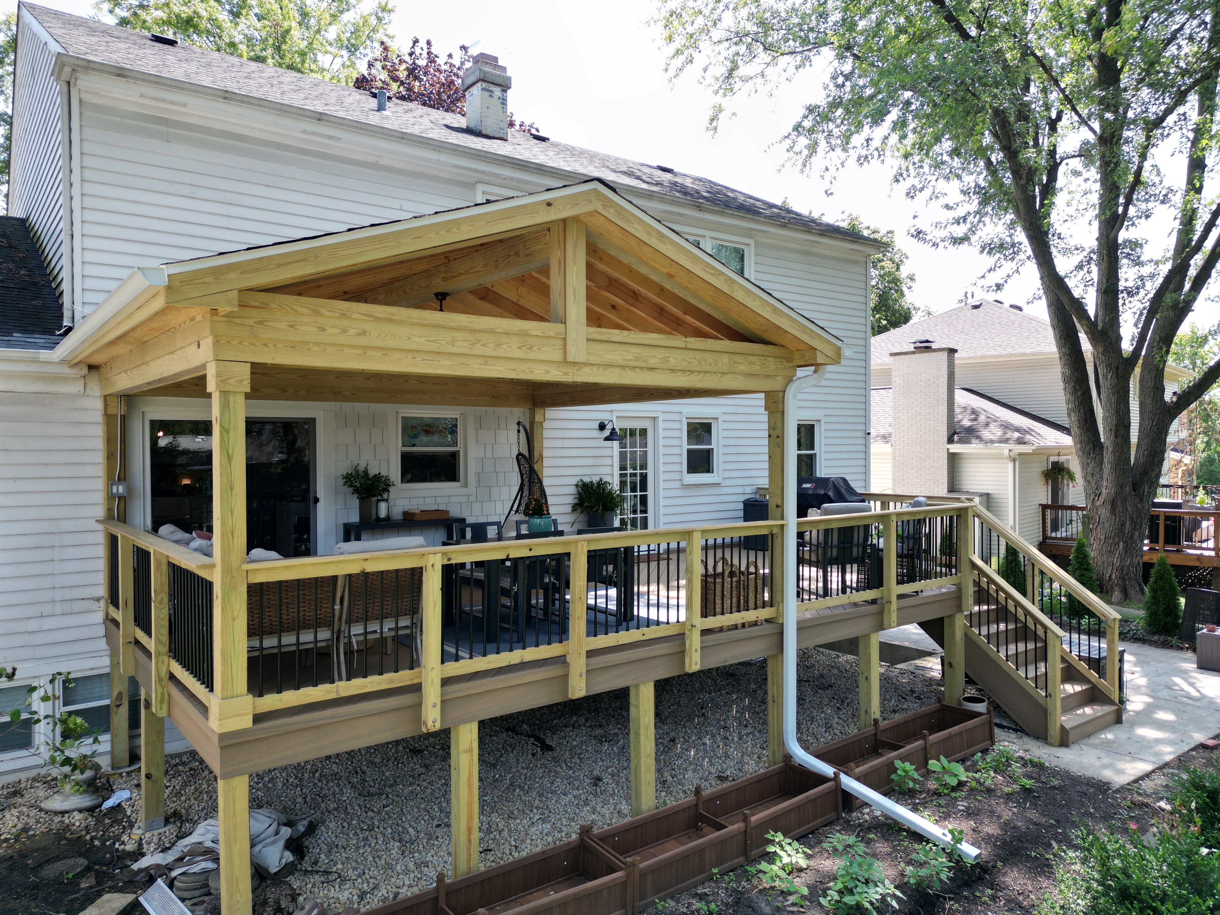 Elevated open porch and timbertech deck combination project by Archadeck of Chicaogland-Naperville.