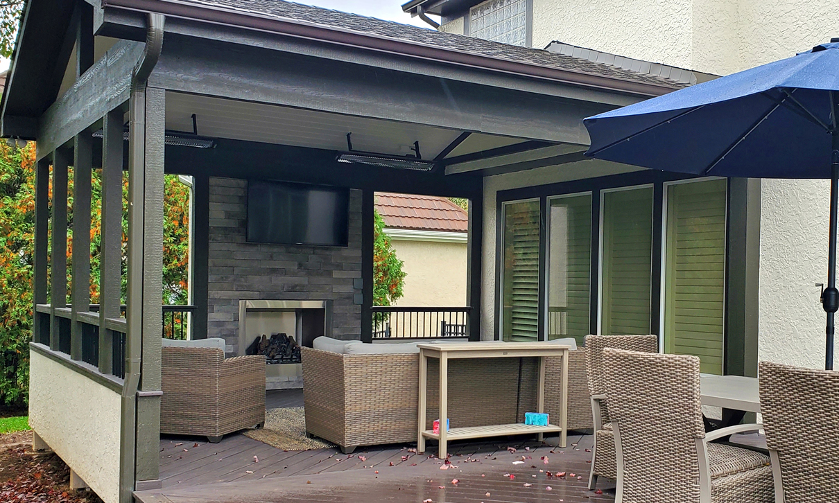 Outdoor fireplace on covered deck in Leawood KS