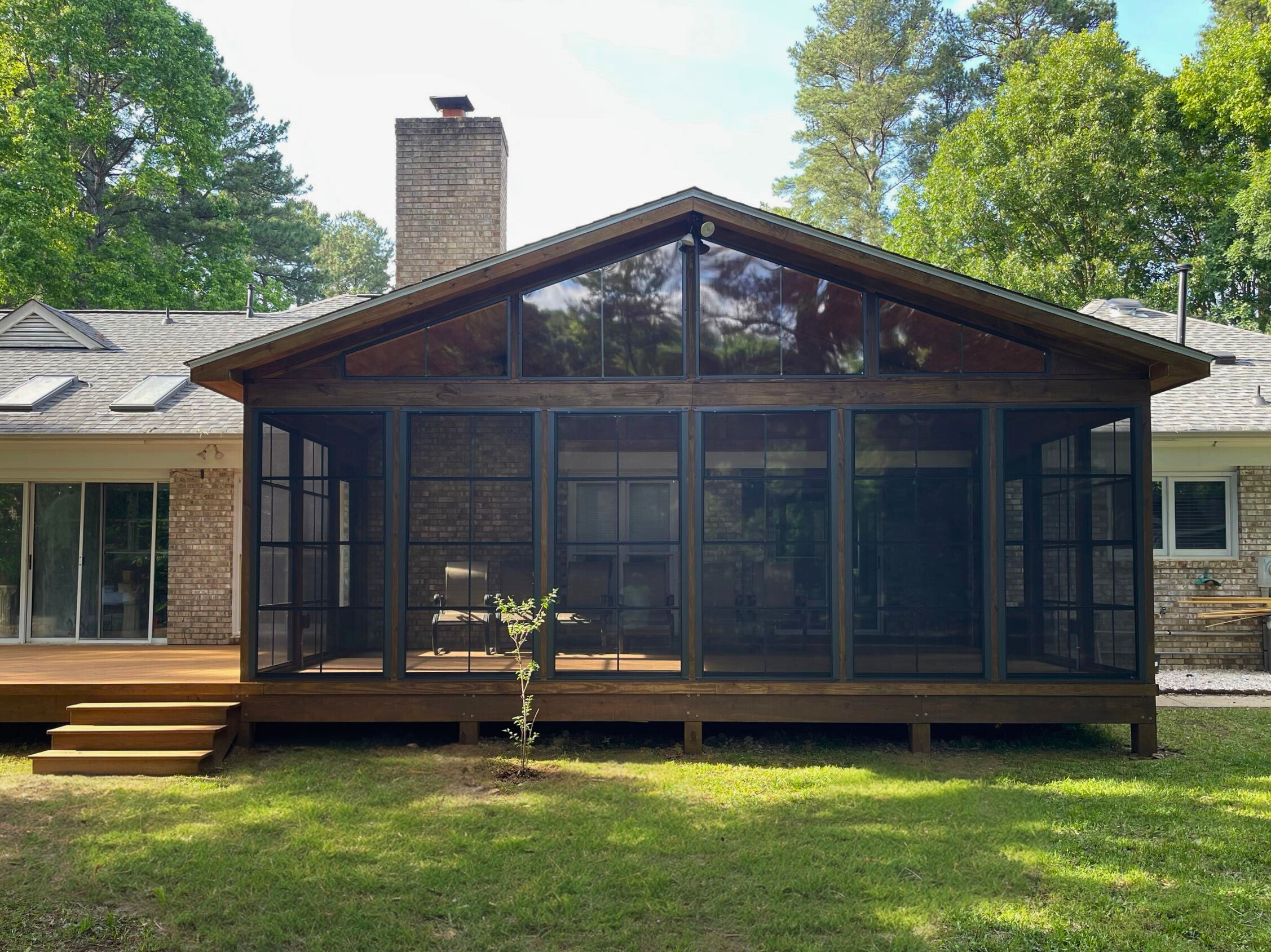 Custom Screened porch with 4-track windwos in Charlotte, NC by Archadeck of Charlotte.