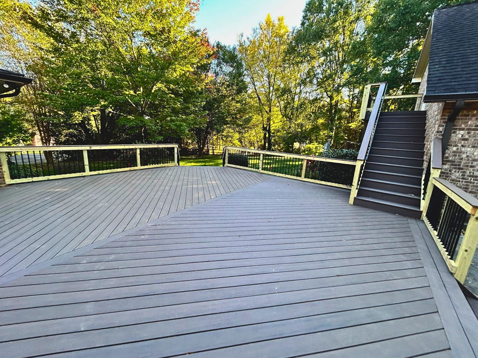 Wood patio with stairs leading to higher level