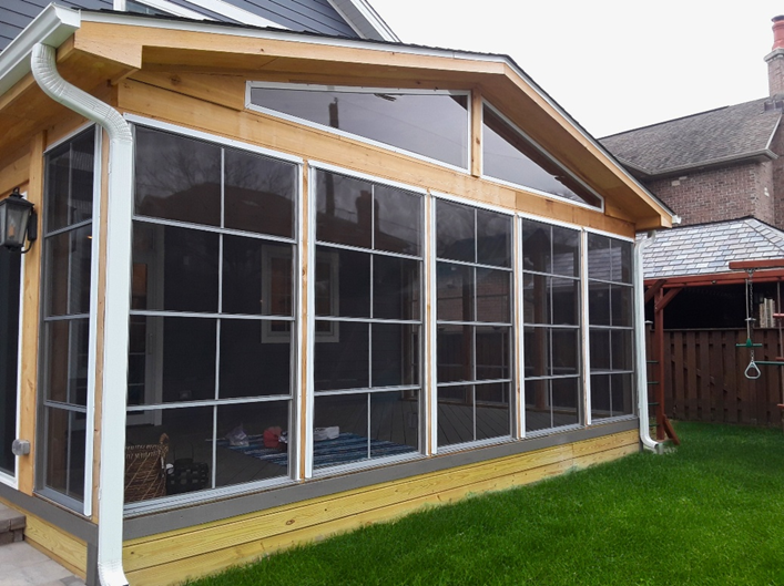 Custom 3-season porch in Arlington Heights with floor-to-ceiling windows and a light wood deck base.