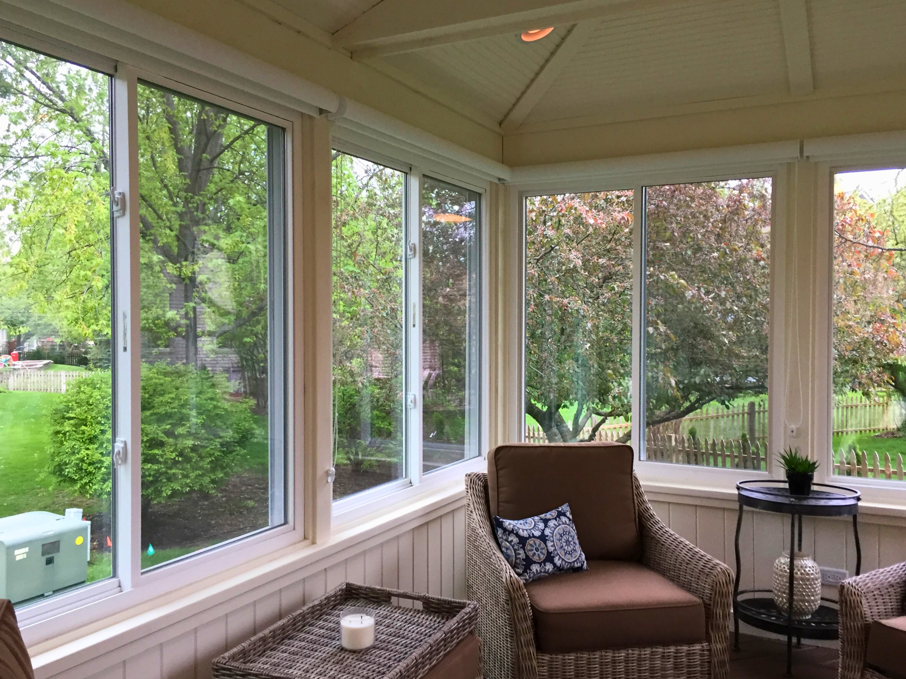 Sunroom with glass windows and beautiful floral trees in Naperville, IL..