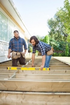 Man leveling a deck