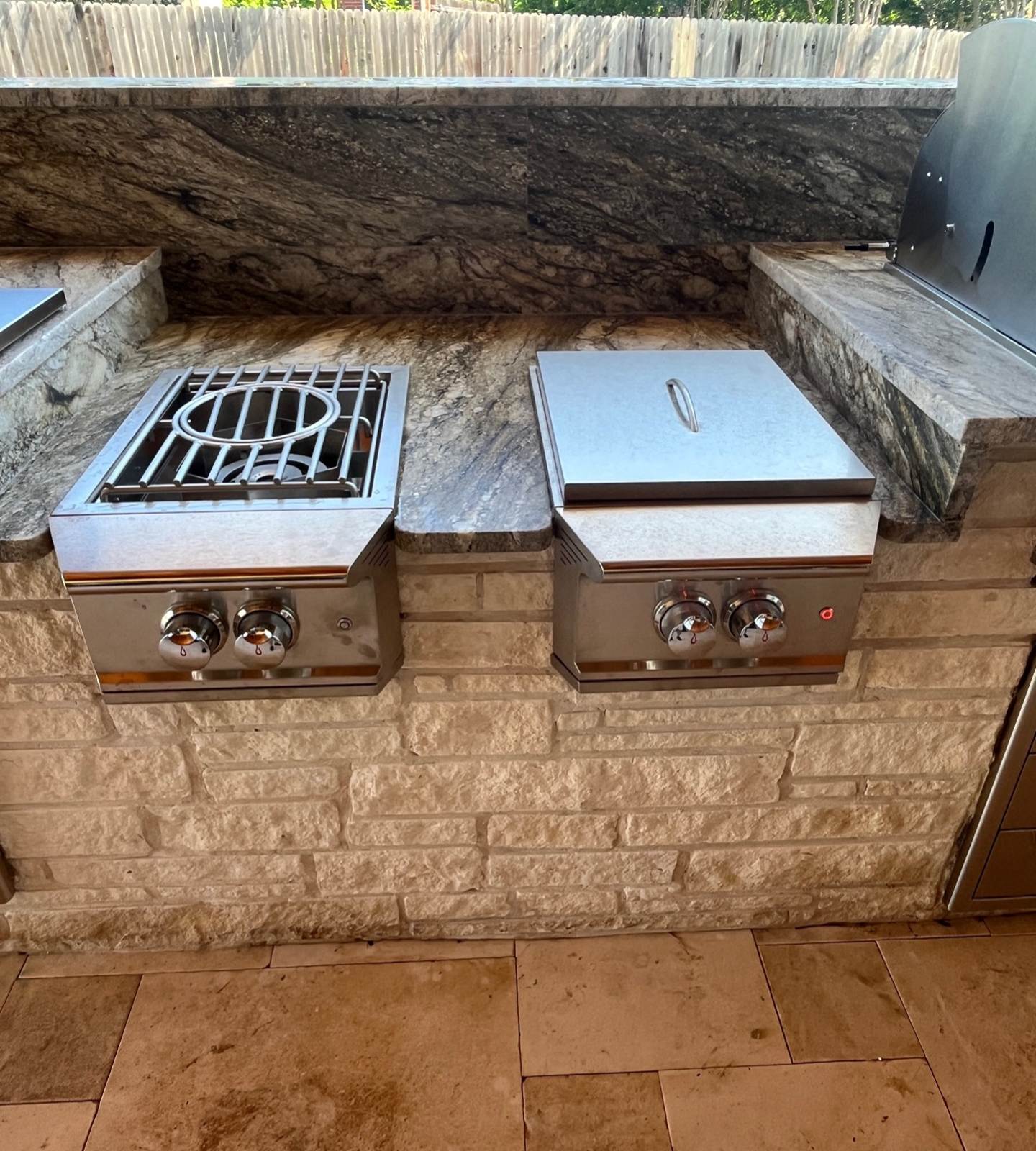 A grills on a stone wall
Description automatically generated