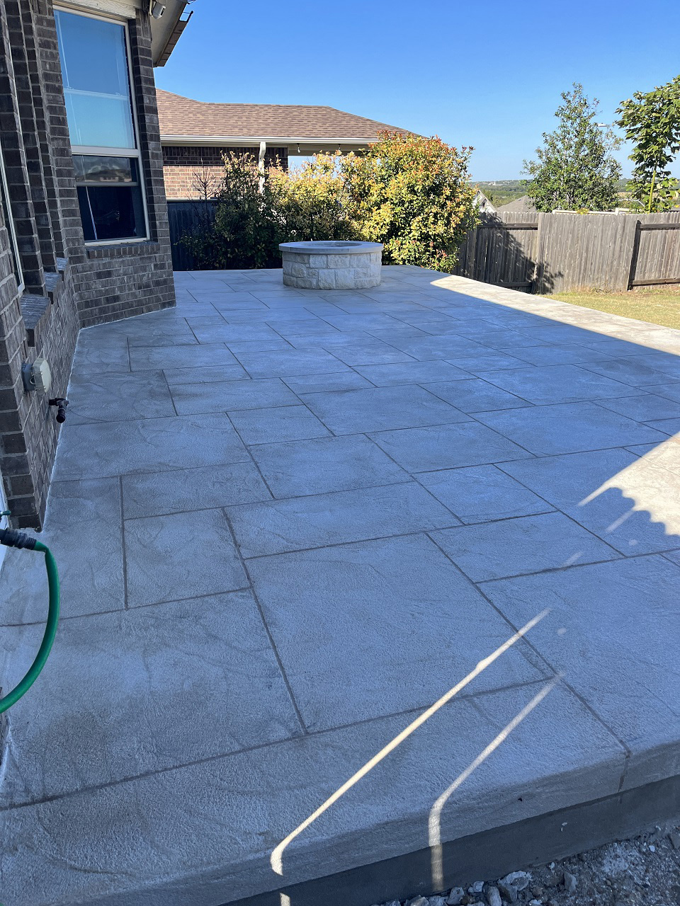 side view of leander patio and fire pit combination space
