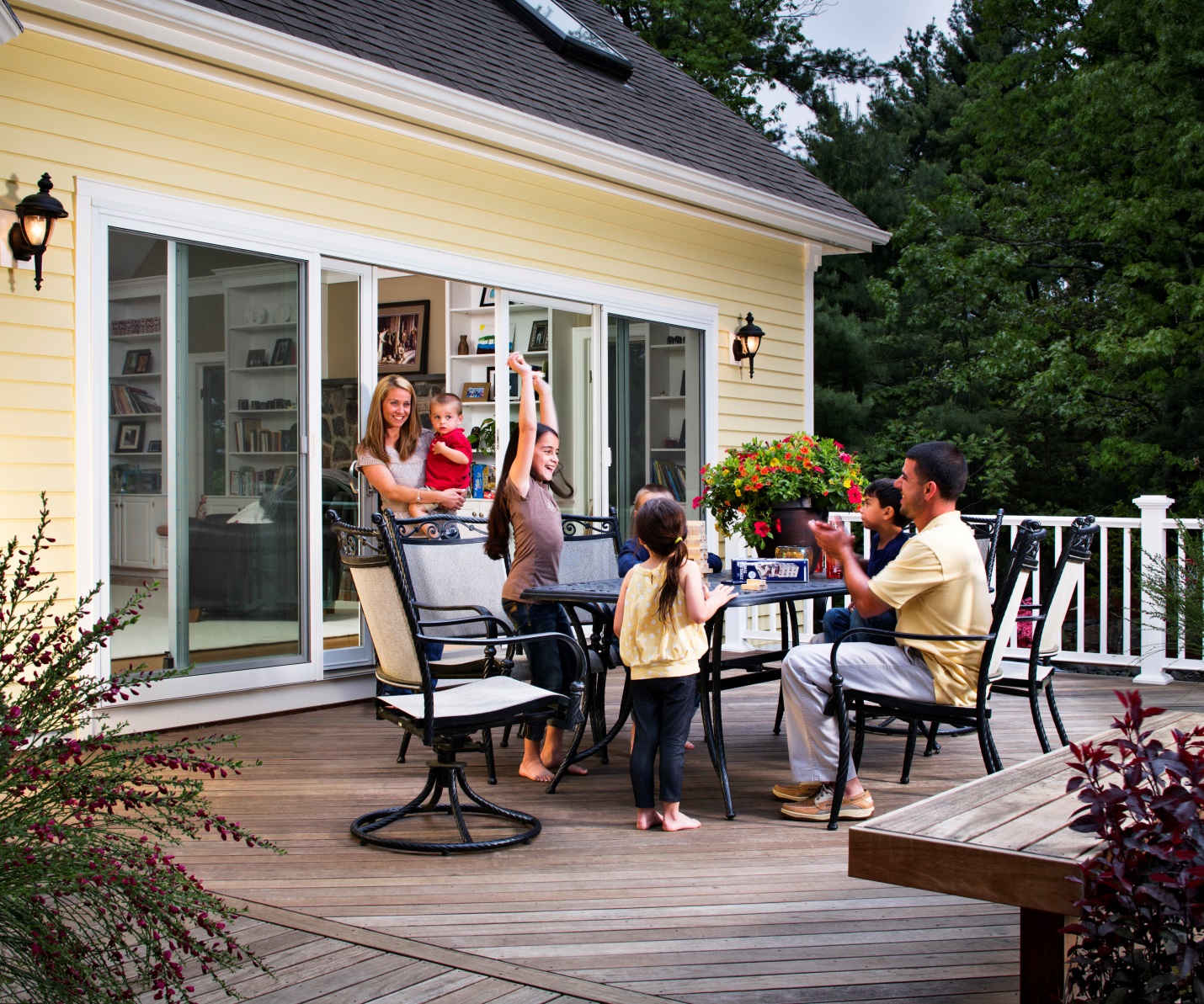 Family Gathered Outside Around Table