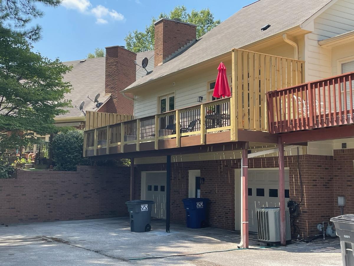 Back of house with deck