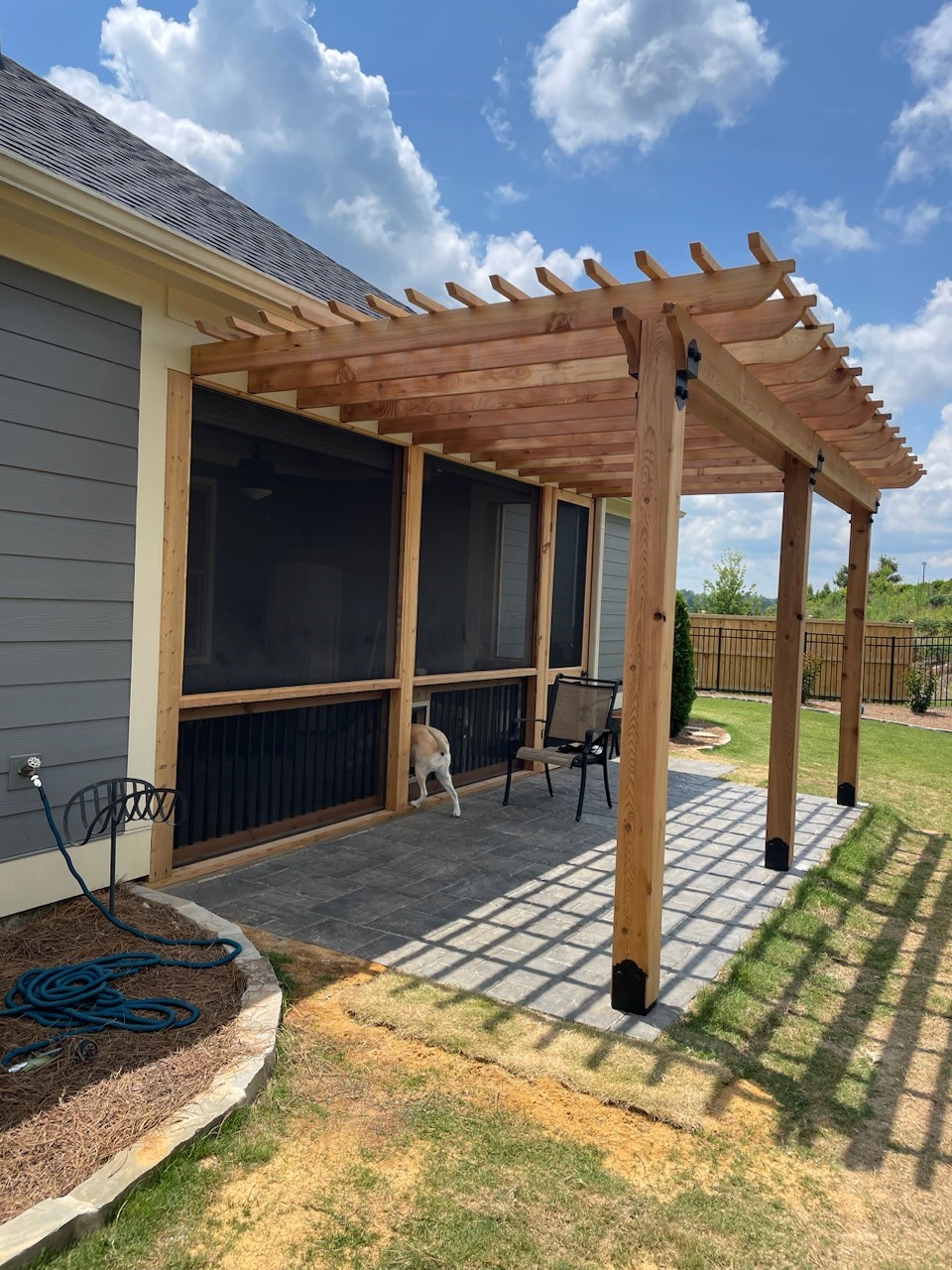 custom wooden pergola with doggie door