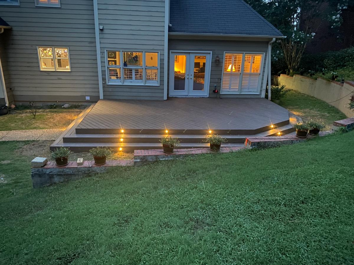 hoover al timbertech custom deck at night showing riser lighting in steps