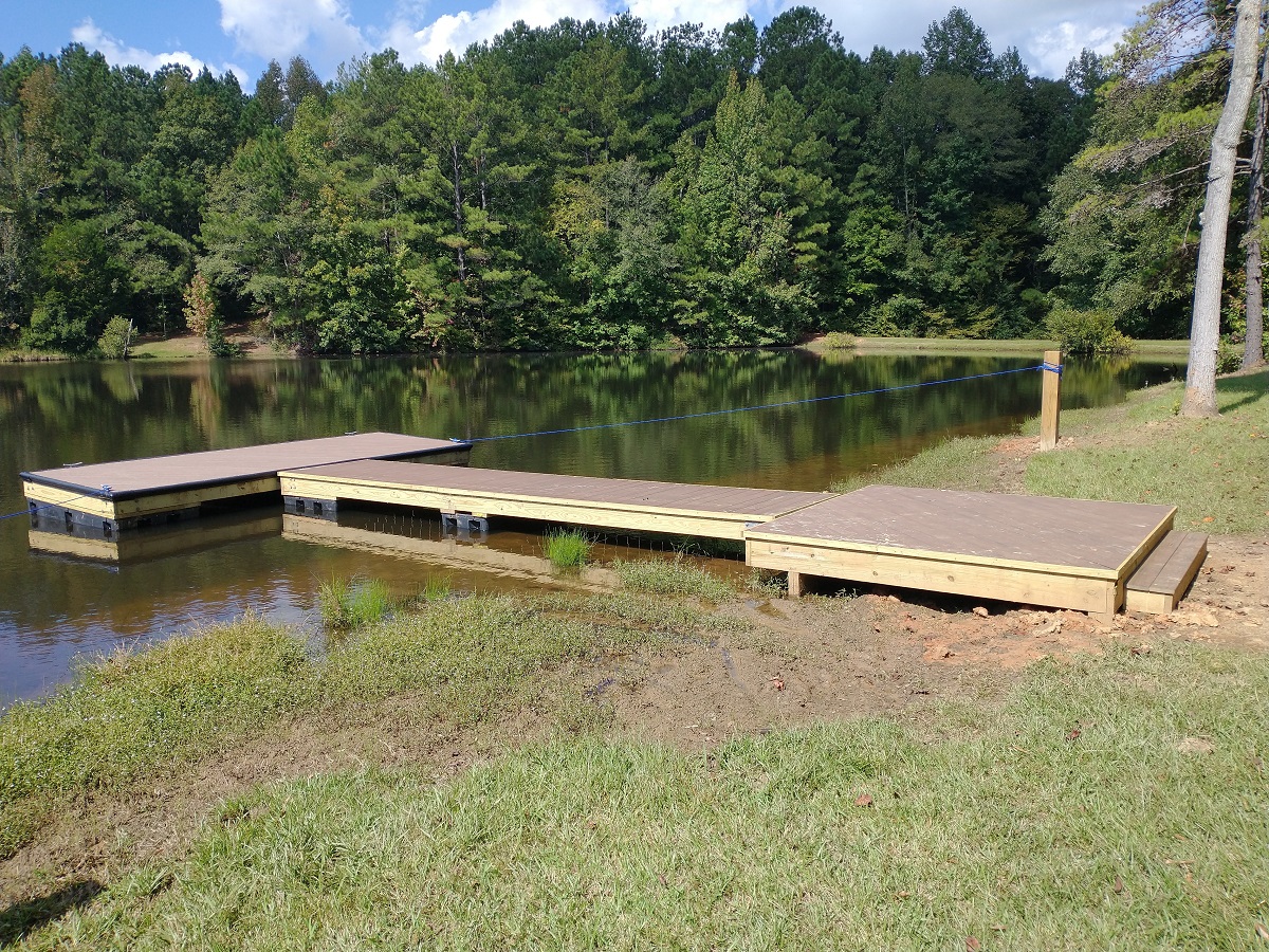 Side view of floating deck dock