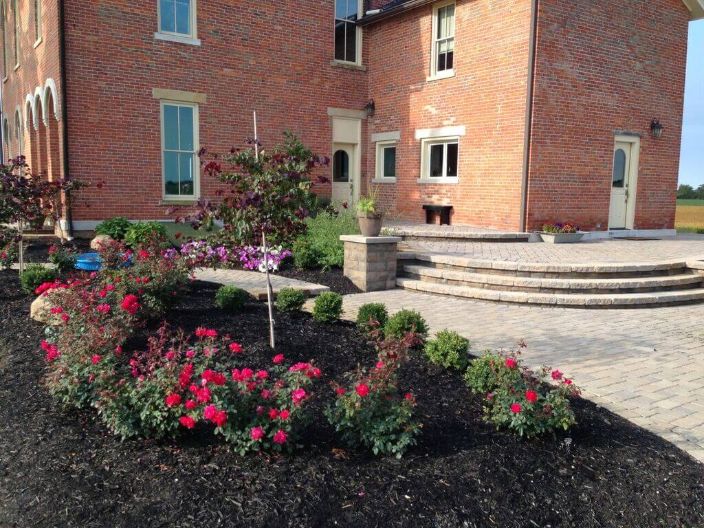 stone patio with flowers and plants