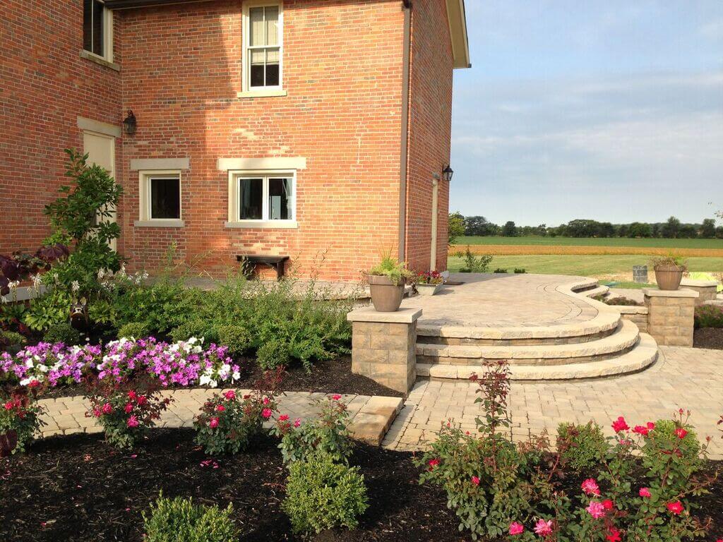 stone patio with flowers and plants