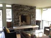 fireplace in screened porch room 