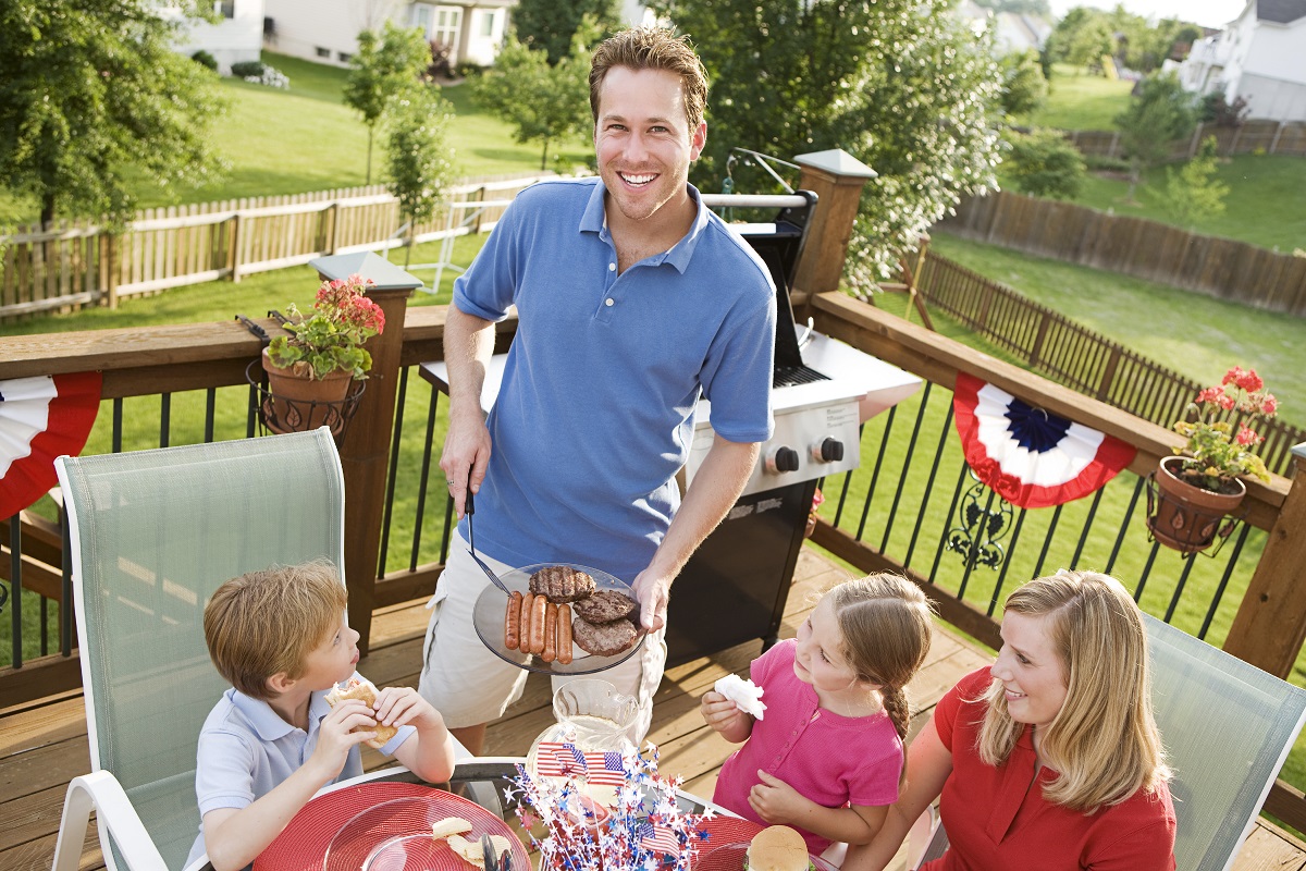 family grilling on patio