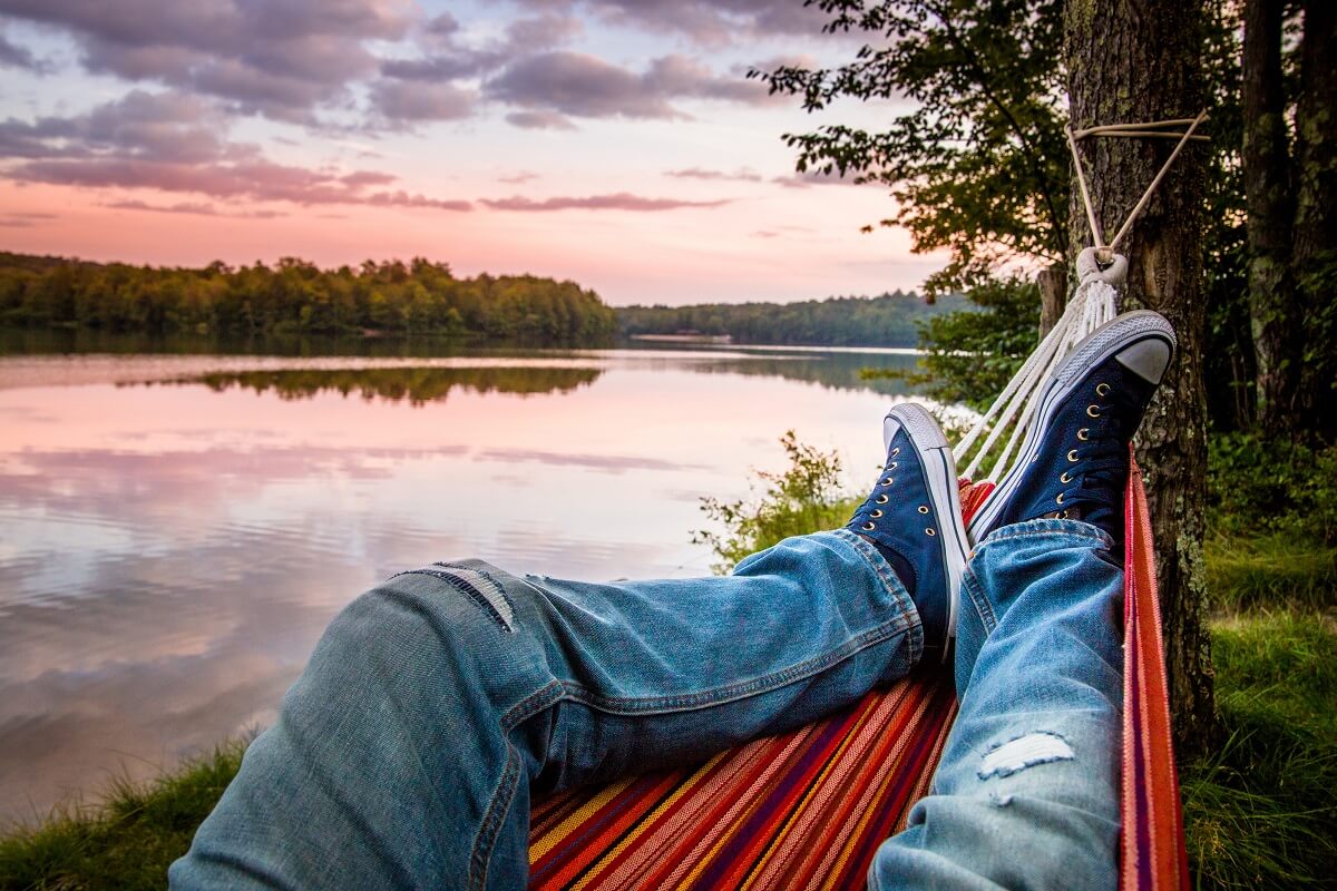 Person lying in a hammock 