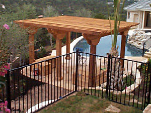 Poolside heavy timber pergola offers refuge
