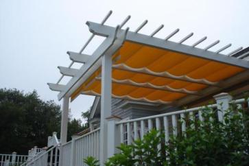 The owners of this pergola added a canopy to shade the sun