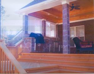 This open porch and hardscape combination in Columbia also features an outdoor kitchen for added luxury.