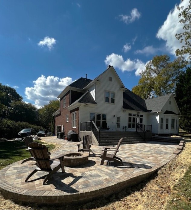 backyard with stone patio and firepit