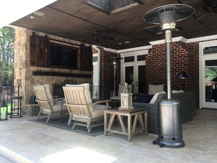 open porch with tv, outdoor heater, and furniture in marvin