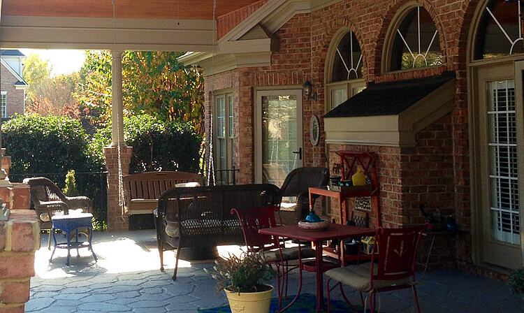 Custom covered porch patio with porch swing and seats