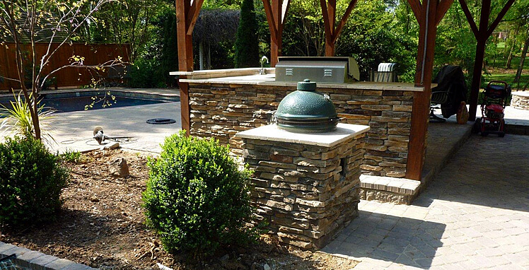 Custom stone facade outdoor kitchen