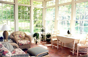 Sun porch with flowery and white furniture
