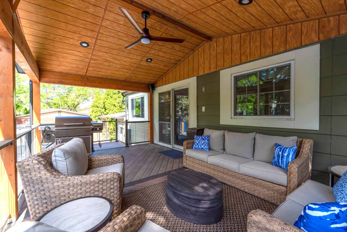 outdoor seating area with ceiling fan