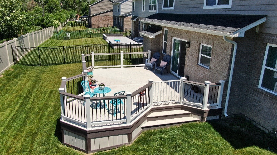 Custom AZEK deck in Orland Park with gorgeous white decking and brown rails and trim.