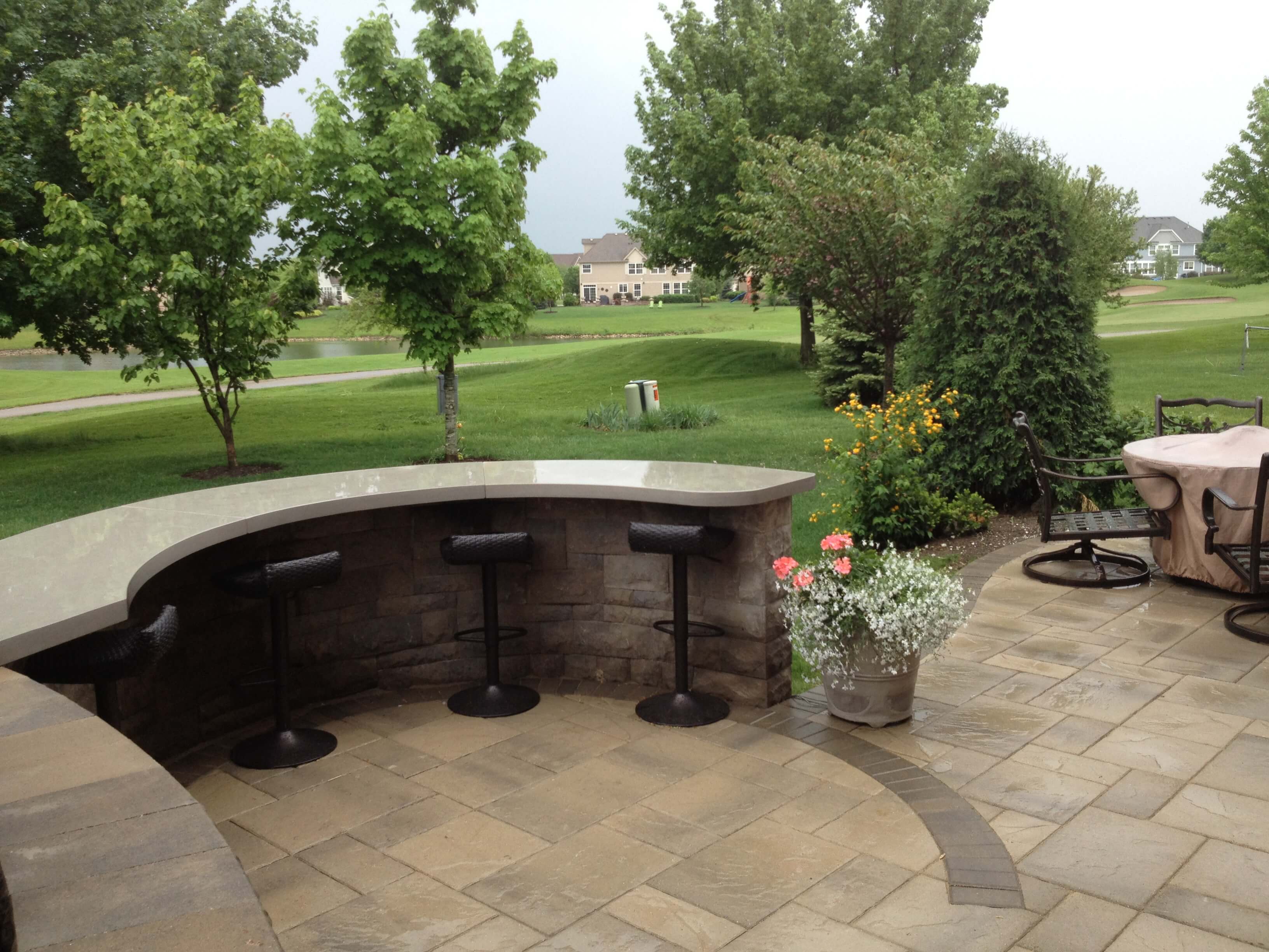 Custom outdoor kitchen with built in bar