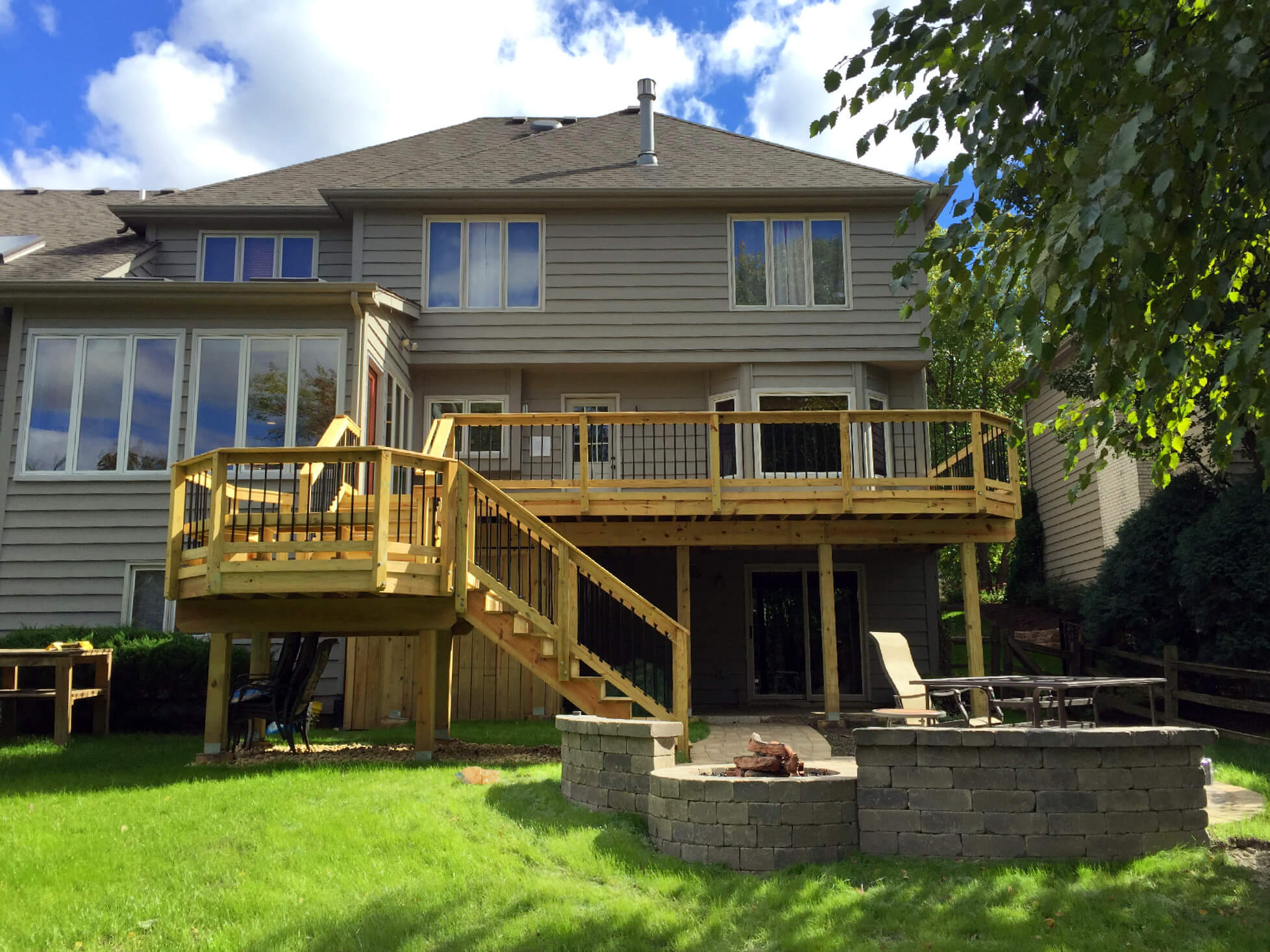 Custom combination of deck and patio with fire pit