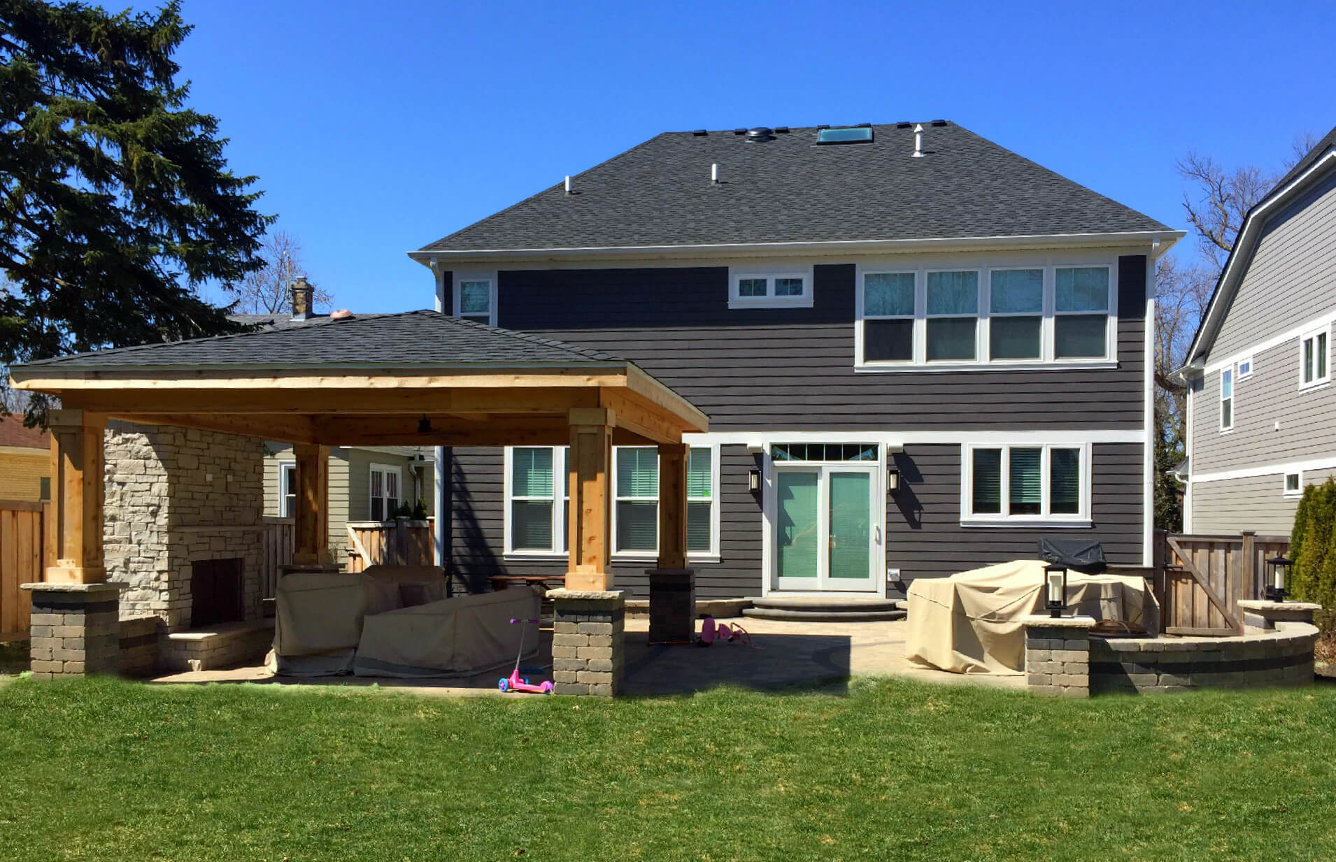 Custom open porch with outdoor fireplace