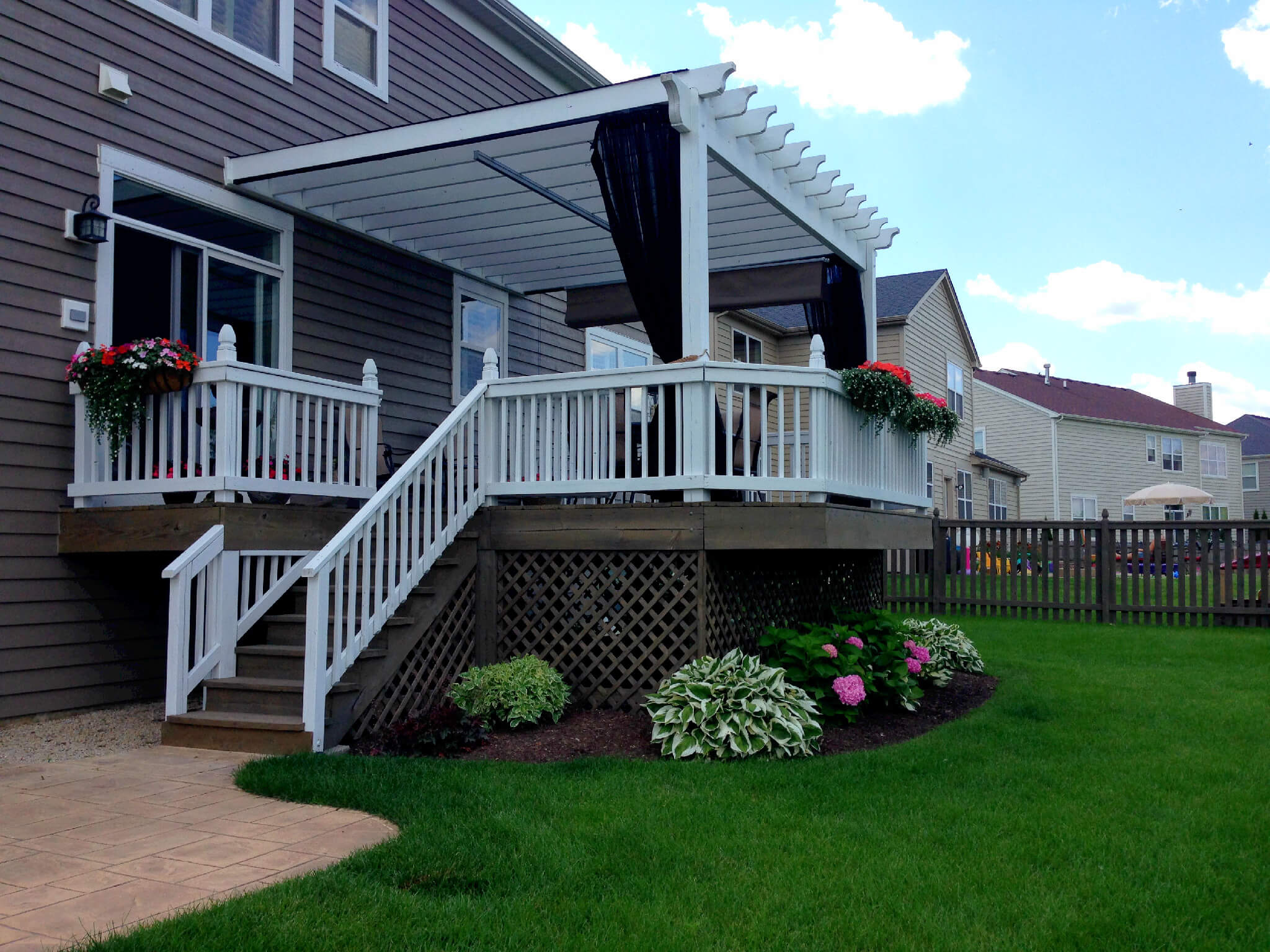 Custom deck and pergola with curtains