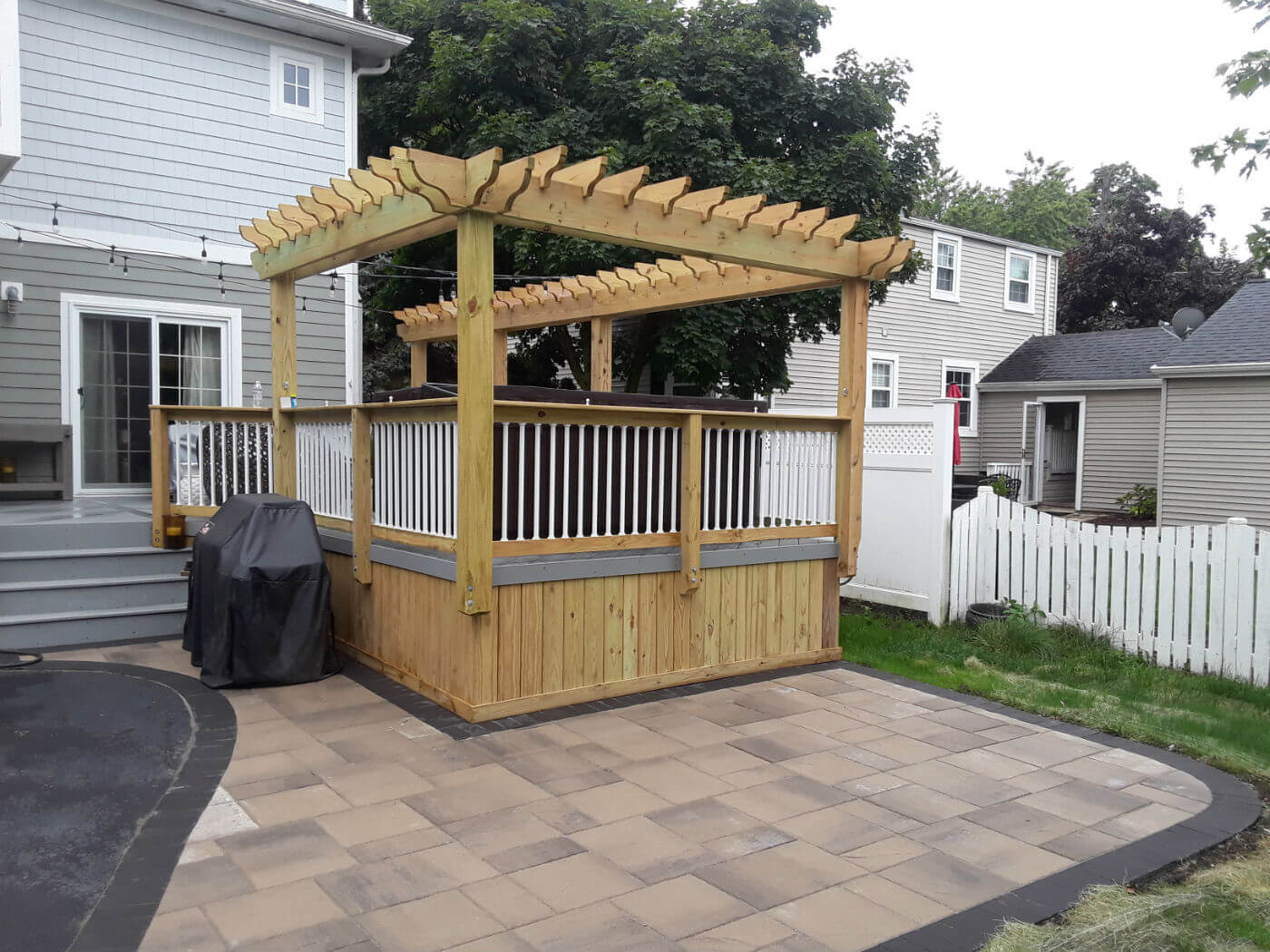 spa deck paver patio with pergola