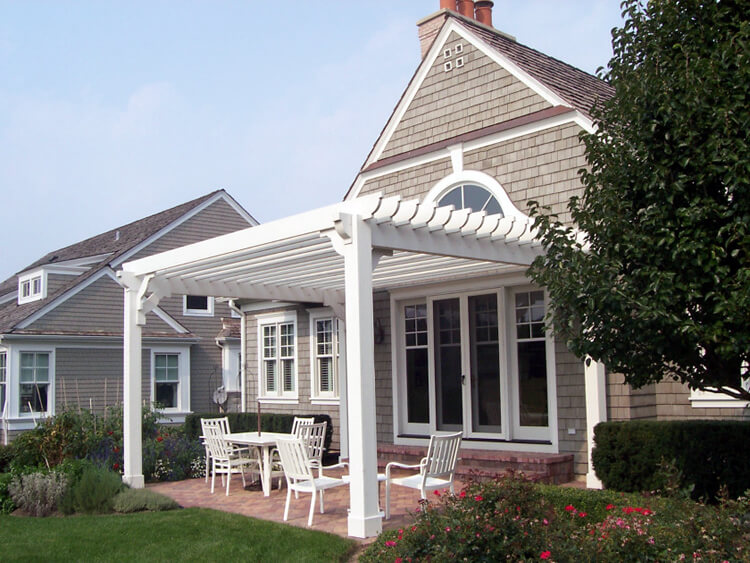 Custom brick patio vinyl pergola
