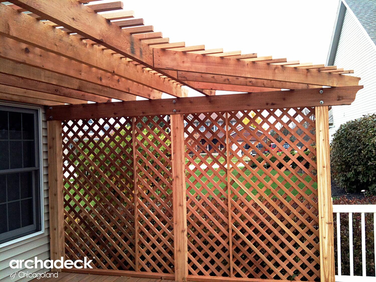 Cedar pergola with lattice privacy wall